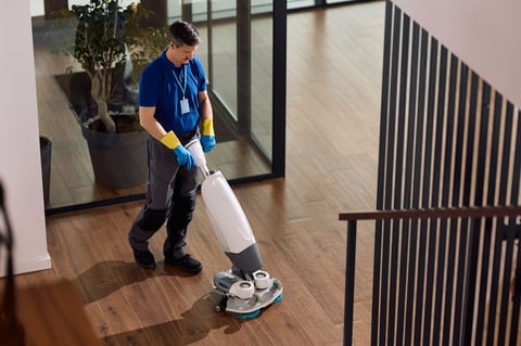 Ezenty In-House Hospitality Technicians — trained hotel floor and surface care technician using professional-grade equipment at a commercial property