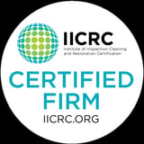 IICRC Certified Firm badge with blue and green spherical logo on white circular background